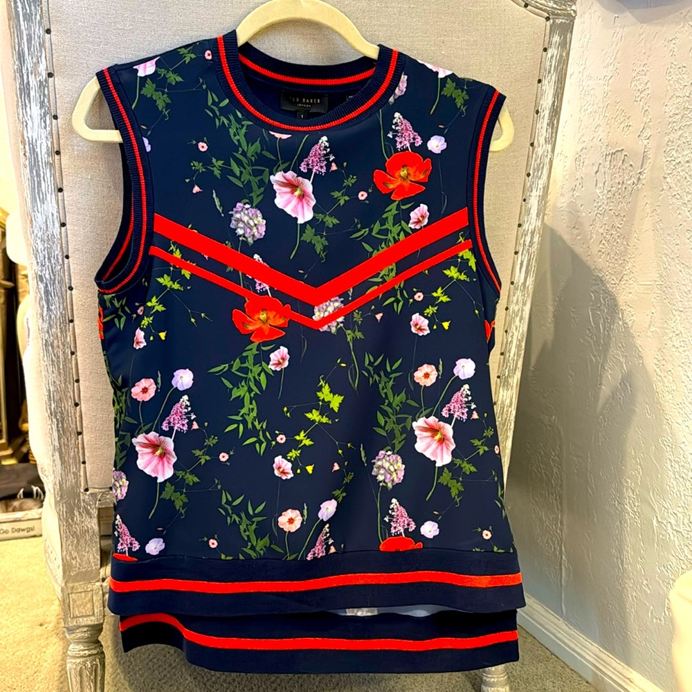 Ted Baker sleeveles navy floral top with knit trip. Matching navy pants.